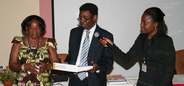 From left to right: Ms Andrea Ouedraogo (Ramsar National Focal Point in Burkina Faso), is presented with the first French Flyway Training Kit by Dr Aimé J. Nianogo (Regional Director for the IUCN Central and Western African Programme) and Ms Evelyn Moloko (Coordinator for the African Initiative of AEWA)
