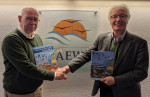 Jacques Trouvilliez and Peter Prokosch with the new edition of the book “The East Atlantic Flyway of Coastal Birds: 50 Years of Exciting Moments in Nature Conservation and Research”.  (Photo: Florian Keil / UNEP/AEWA Secretariat)